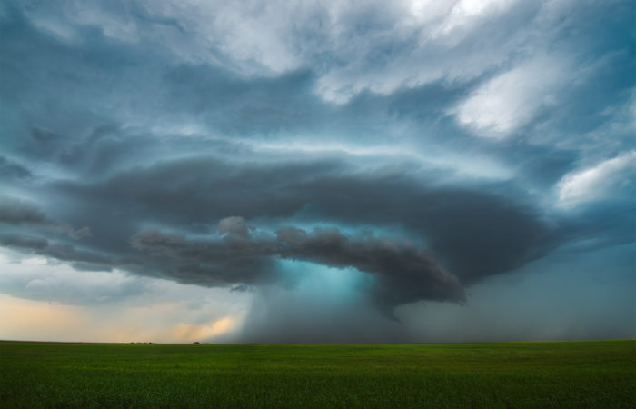 A supercell thunderstorm with tornado touching down in saskatchewan